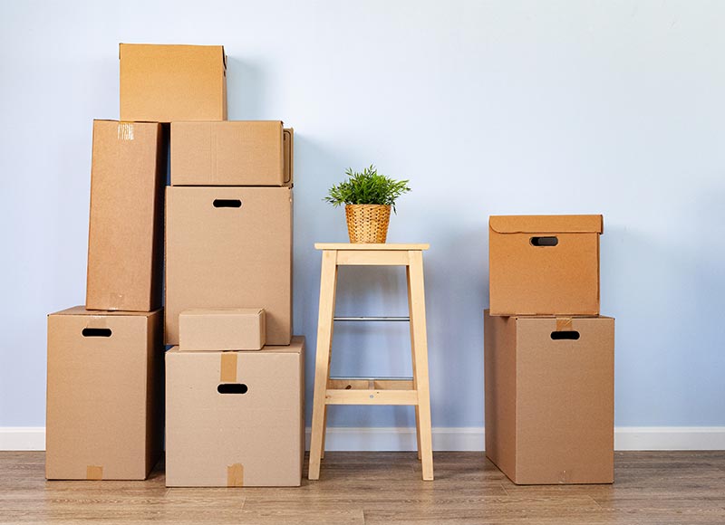 moving boxes with packed stuff and chair for movin 6pymjc8.jpg